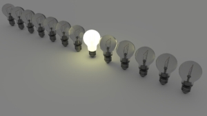 Light bulbs standing out from the crowd